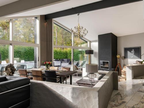 a living room with a couch and a table at Villa Frösakull Paradiset by Interhome in Frösakull