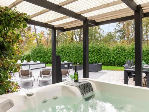 a bath tub in the middle of a patio at Villa Frösakull Paradiset by Interhome in Frösakull
