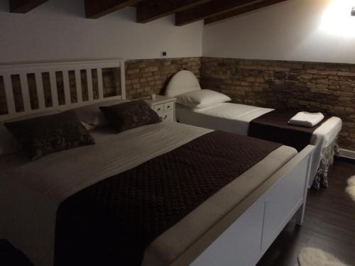 Postel nebo postele na pokoji v ubytování B&B S.Antonio