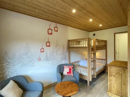 a living room with two bunk beds and a couch at Studio divisible, ski aux pieds, vue sur pistes - FR-1-181-2677 in La Plagne Tarentaise