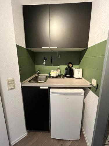 Kuchyň nebo kuchyňský kout v ubytování Citynahes modernes Apartment