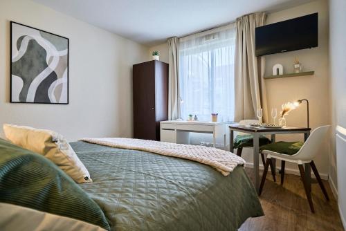 Ένα ή περισσότερα κρεβάτια σε δωμάτιο στο Elegant and cozy Vauban studio