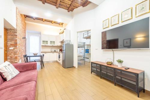 a living room with a couch and a table at La bella Flora in Ariccia