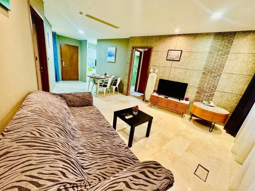 a bedroom with a zebra print bed in a room at vortex KLCC YOUR HOME in Kuala Lumpur