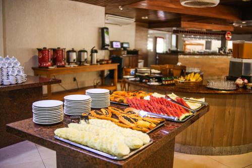 a buffet of food on a table in a restaurant at China Park Eco Resort in Pedra Azul