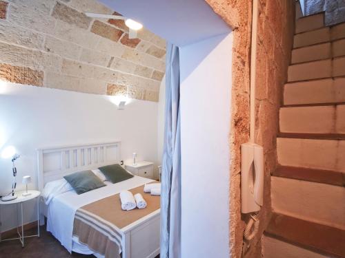 Postel nebo postele na pokoji v ubytování Torretta del Centro