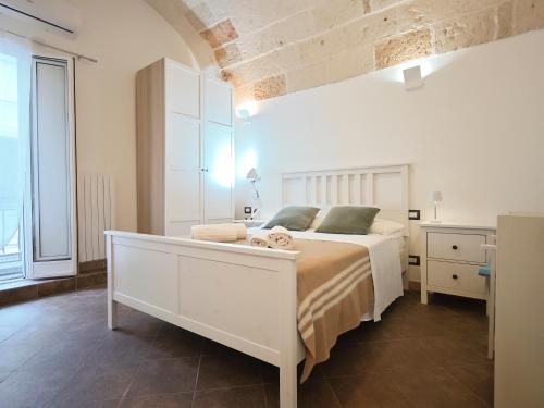 Postel nebo postele na pokoji v ubytování Torretta del Centro