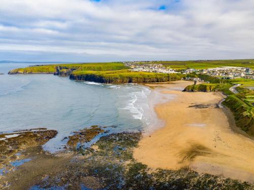 an aerial view of the shoreline of a beach at Holiday Home Ballybunion - TR4 HC No 27 by Interhome in Ballybunion