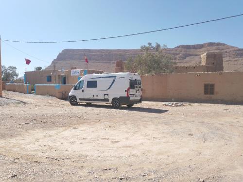 a white van parked in front of a building at Gîte Palma Eagle Ziz Canyon in Er Rachidia