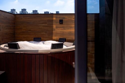 Φωτογραφία από το άλμπουμ του Boutique Apartment - Completo e em frente a Praia Brava σε Itajaí