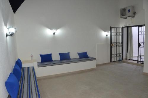 Ένα ή περισσότερα κρεβάτια σε δωμάτιο στο Lella Baya Apartment