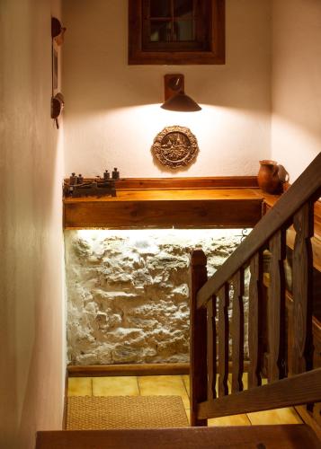 a stairway with a wooden railing and a stair case at Penzion Barborka in Poprad