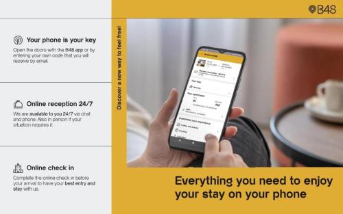 a person holding a cell phone in their hand at B48 Valencia Feria in Valencia