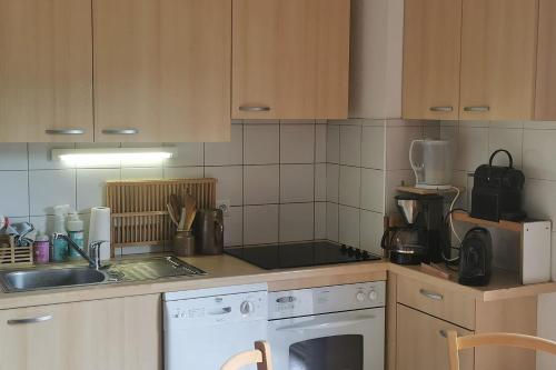 Η κουζίνα ή μικρή κουζίνα στο Charming duplex with 2 balconies and view