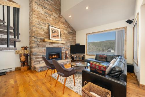 a living room with a couch and a fireplace at Snowblaze Condos Building A unit 33 in Winter Park
