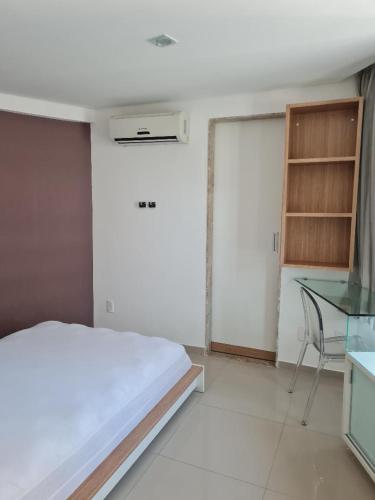 Ένα ή περισσότερα κρεβάτια σε δωμάτιο στο Flat mobiliado e bem localizado