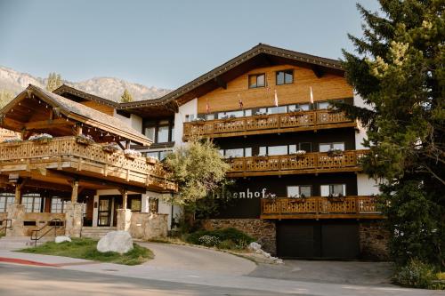 a large building with wooden balconies on the side of it at The Alpenhof in Teton Village