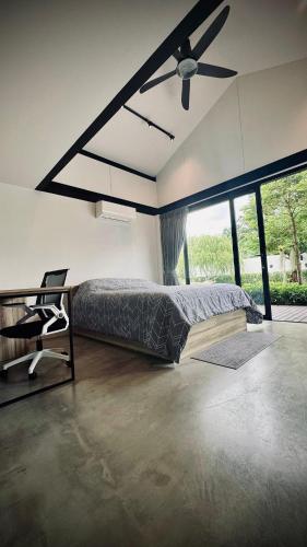 a bedroom with a bed and a ceiling fan at 913 Luxury Pool Villa Khaolak in Khao Lak