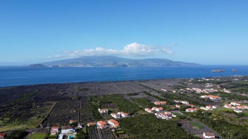 an aerial view of a town and the ocean at AL Novavista by A5P in Madalena