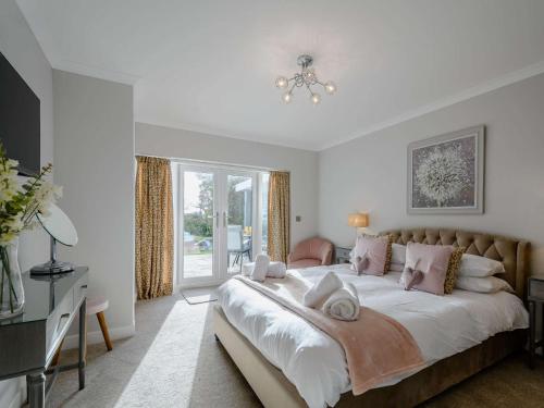a bedroom with a large bed and a window at 1 Bed in Sandyhills 85904 in Fairgirth