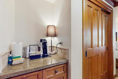 a hotel room with a counter with a lamp on it at 556 Everline in Olympic Valley