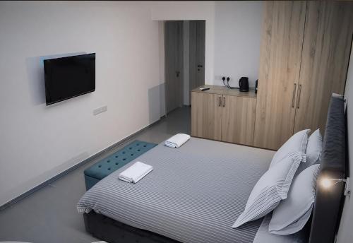 Postel nebo postele na pokoji v ubytování Plateia Suite Deluxe