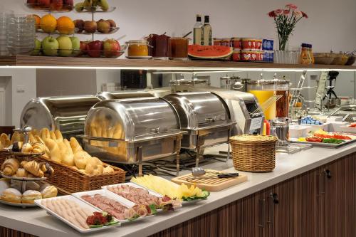 a buffet line with different types of food on it at Annabelle Studio in Batumi