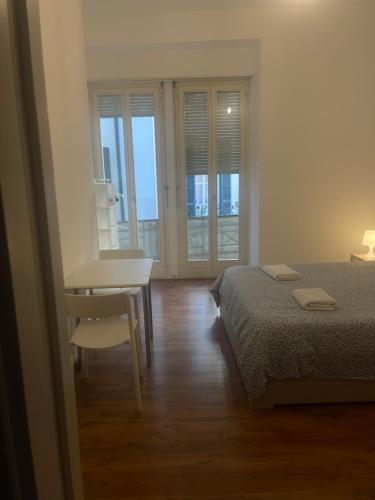 Postel nebo postele na pokoji v ubytování Rivellino Guesthouse app 2