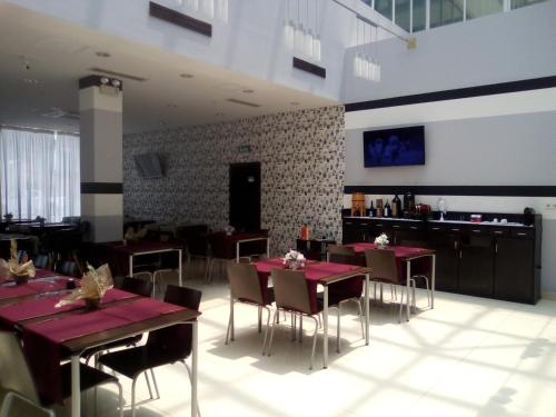 TV a/nebo společenská místnost v ubytování Hotel Vila da Restinga