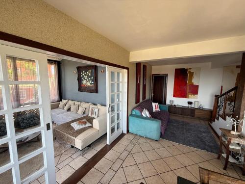 En eller flere senge i et værelse på Alto João Fernandes