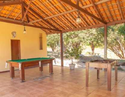 a room with two ping pong tables in it at Hotel Fazenda Moinho in Esmeraldas