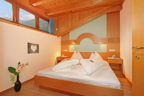 En eller flere senge i et værelse på Appartements Obermairhof