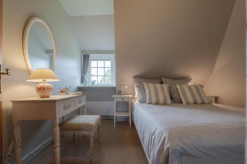 Кровать или кровати в номере Haus Wattblick OG