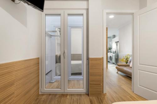 a sliding glass door in a living room at Apartamento Reyes Católicos Conil in Conil de la Frontera