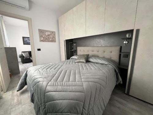 a bedroom with a large bed with a large headboard at A casa di Alida in Cotulo