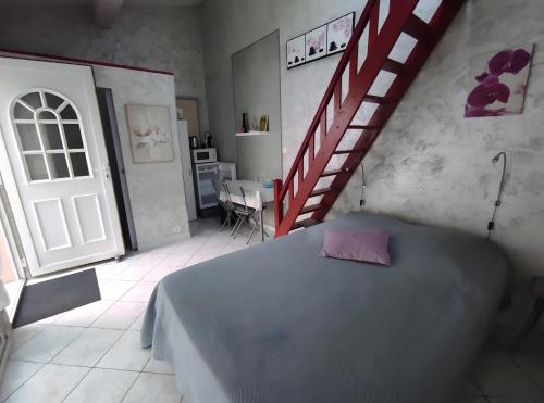 Un ou plusieurs lits dans un hébergement de l'établissement Chambres d'hôtes - Les Orchidées