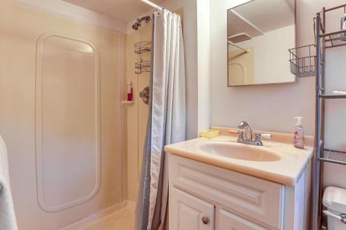 a bathroom with a sink and a shower at 2 Mi to NYC Train Greenwich Apt with River View in Rye Brook