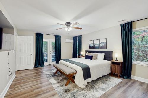 a bedroom with a bed and a ceiling fan at Hawk’s Landing at Innsbruck in Helen