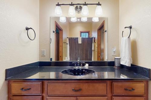a bathroom with a sink and a large mirror at Eagle Rock in Beech Mountain