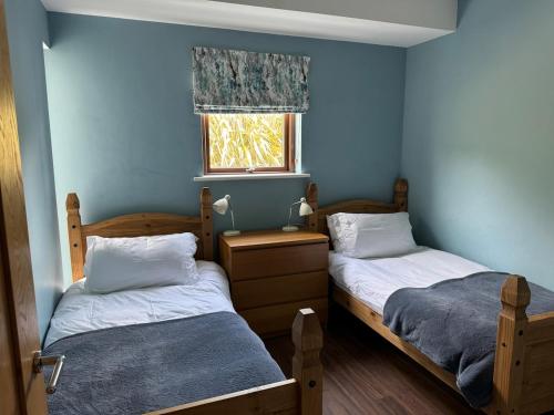 Ένα ή περισσότερα κρεβάτια σε δωμάτιο στο Luxury house on the Wild Atlantic Way