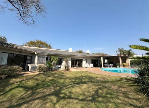an image of a house with a swimming pool at Stone Trading Pty Ltd in Durban