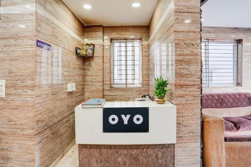 an office with a desk with the ovo logo on it at Hotel O Royal galaxy suites in Bengaluru