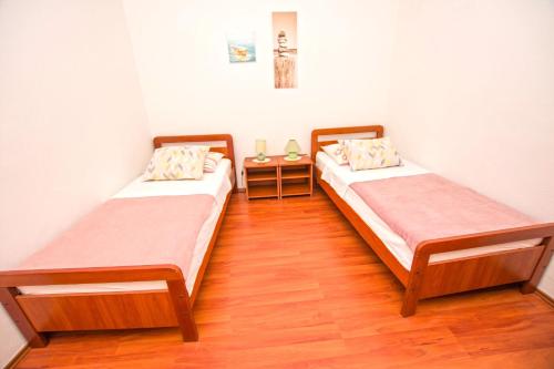 Postel nebo postele na pokoji v ubytování Apartment Centrum