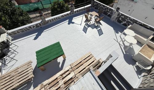 an overhead view of a patio with tables and chairs at Casa LuLa in Villafranca de Córdoba
