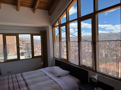 Postel nebo postele na pokoji v ubytování Yanapanakusun Cusco