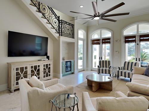 a living room with a flat screen tv and a couch at Blue Mountain Bella in Blue Mountain Beach