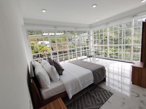 Ένα ή περισσότερα κρεβάτια σε δωμάτιο στο Villa Rosaria