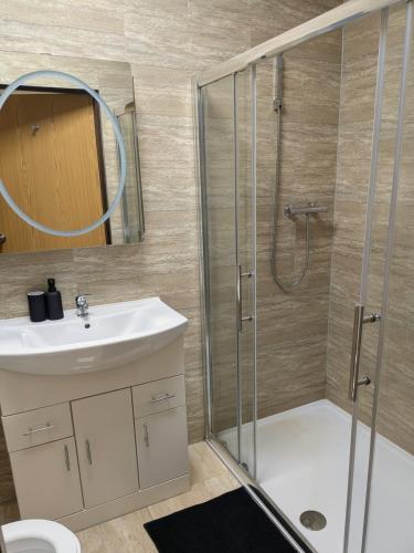 a bathroom with a shower and a sink at Allen's property in Birmingham