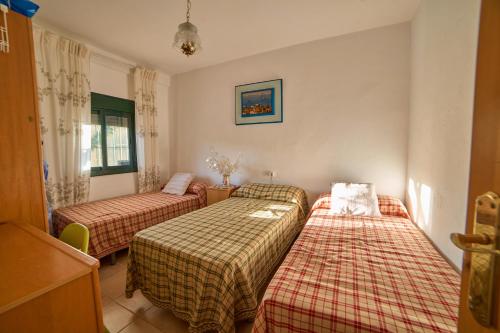 Postel nebo postele na pokoji v ubytování Huerta del Sol