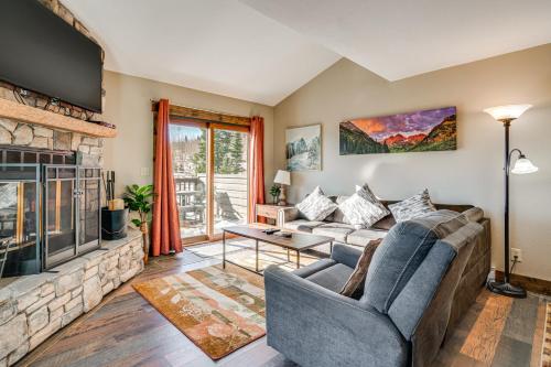 a living room with a couch and a fireplace at Multi-Level Haven 3 Mi to Lake Dillon in Silverthorne